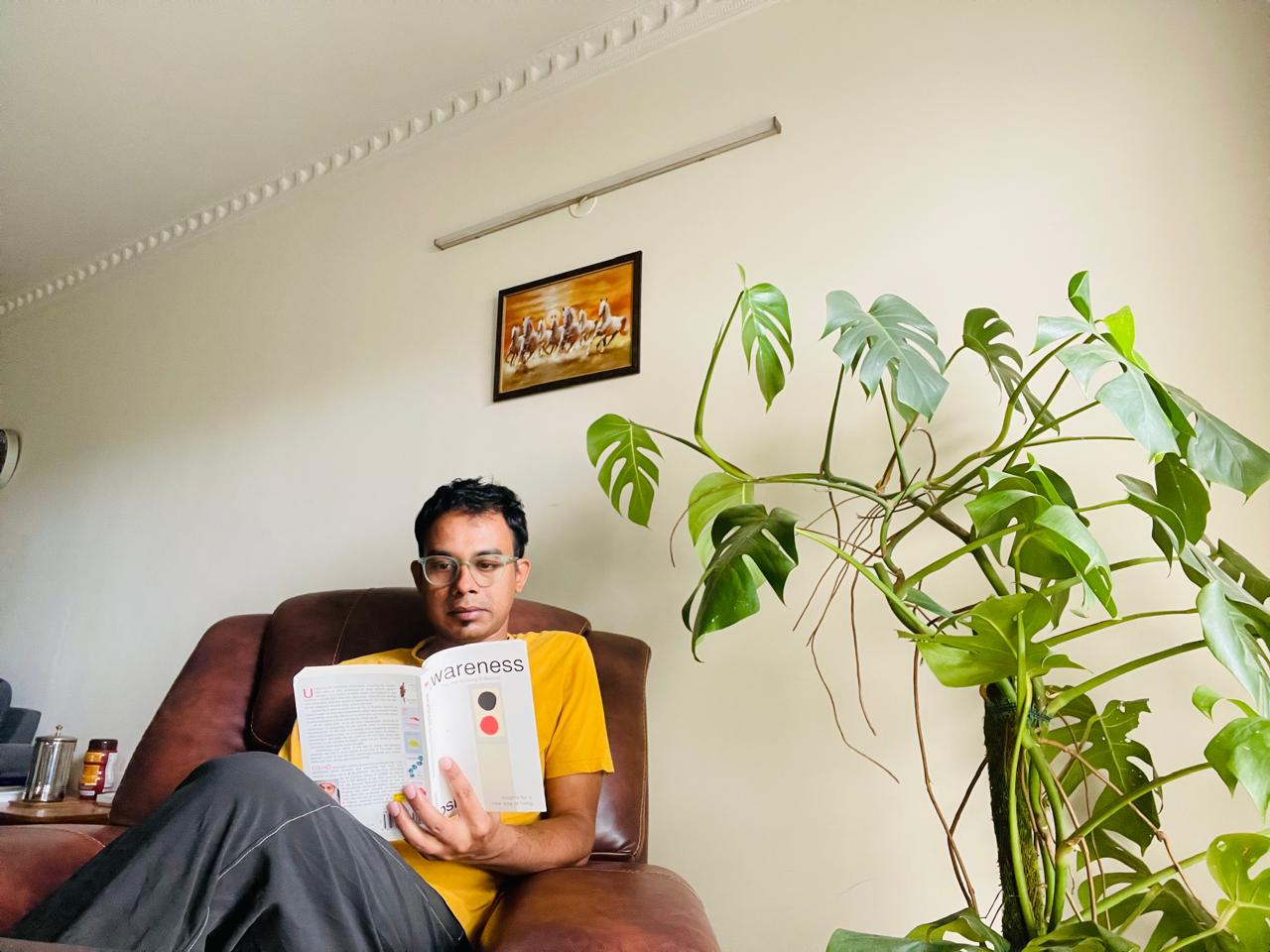 Satyabrat off-duty, reading